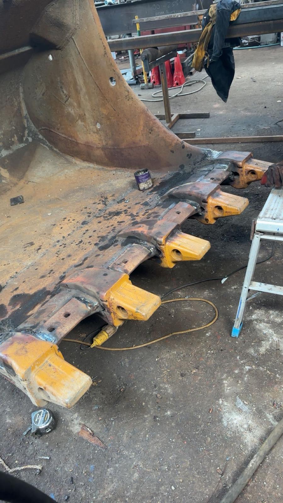 Telehandler bucket teeth re-welded