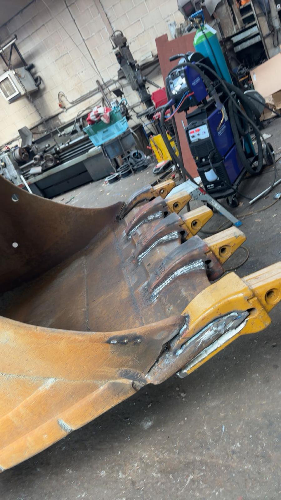 Digger bucket teeth welded on